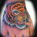 Tiger hand tattoo