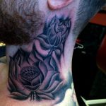 Black and grey flower neck tattoo