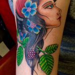 Lady with flowers tattoo