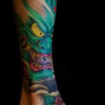 Green demon shin tattoo