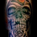 Skull rose and butterfly tattoo