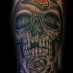Skull and butterfly tattoo