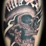 Skull and cards tattoo