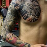 Japanese chest and arm tattoo