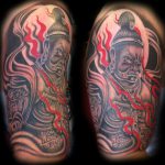 Demonic buddha tattoo