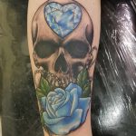 Skull, diamond and rose tattoo