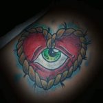Heart and eye tattoo